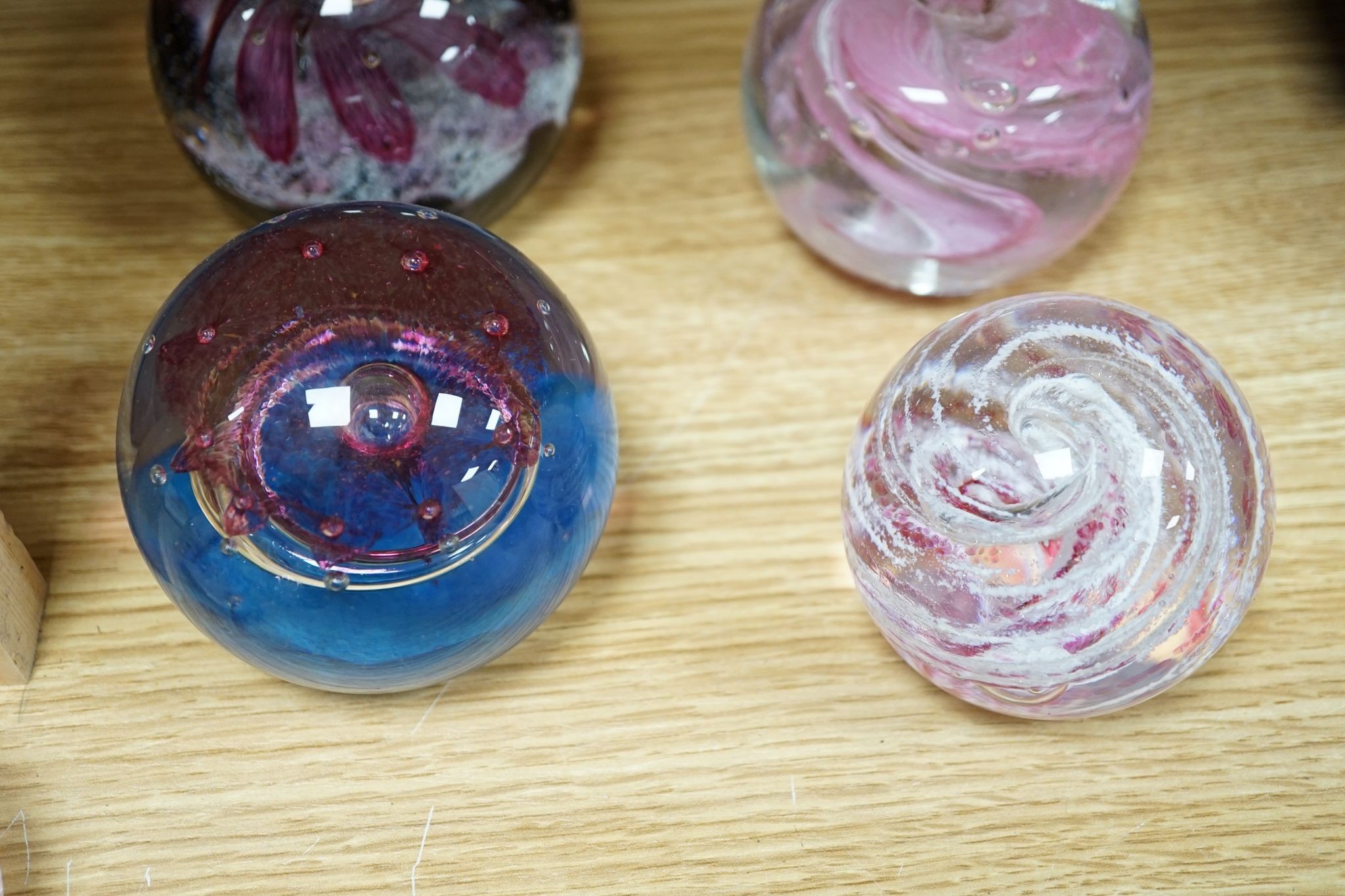 A group of glass paperweights including Caithness